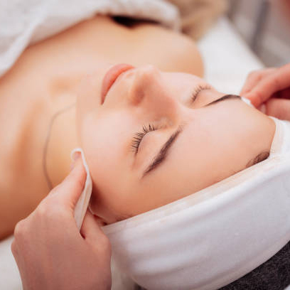 Caring about skin. Nice good looking woman visiting a cosmetology clinic while caring about her skin